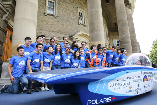 The Blue Sky Solar Racing Team gathers behind Polaris, the vehicle they will enter into the 2017 Bridgestone World Solar Challenge. (Photo: Roberta Baker)